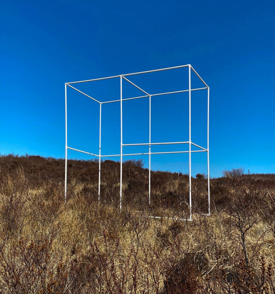 portable bus stop in brown heather with bright blue sky